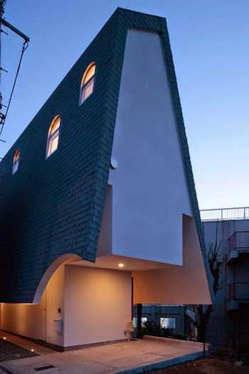 Japanese Vertical House Design Boasts Different Sized Windows and Openings