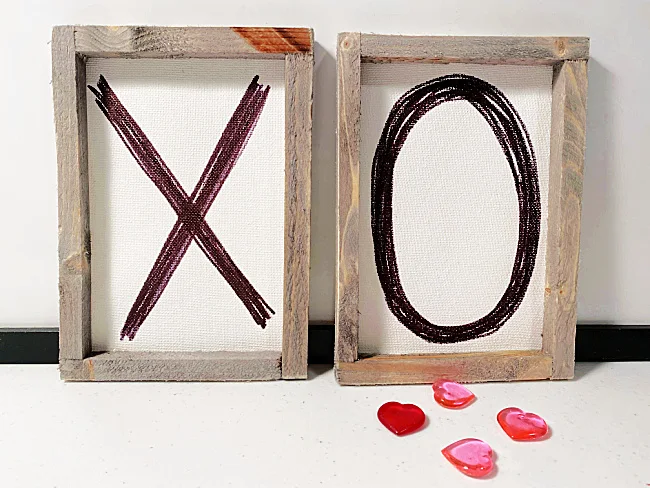 Framed x and o canvases with hearts
