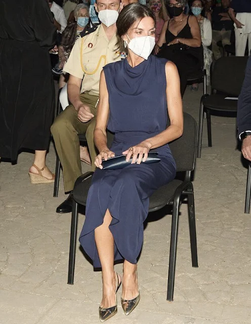 Queen Letizia wore a new blue navy silk sleeveless top and skirt. Magrit gold metallic pumps, Coolook earrings