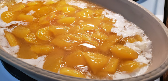 Stone dish of peaches and batter