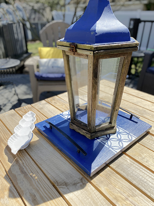 blue lantern and blue furniture on the deck