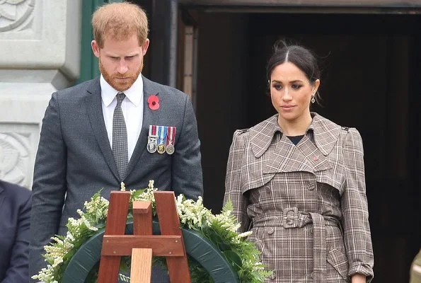 Meghan Markle wore Karen Walker Banks coat, Asos Design Maternity dress, Sarah Flint pumps and Birks Musecitrine and diamond drop earrings