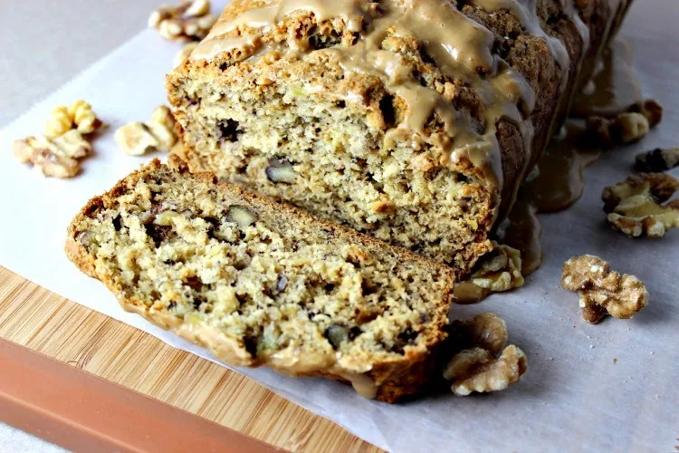   Maple Walnut Banana Bread with Maple Glaze cut on platter