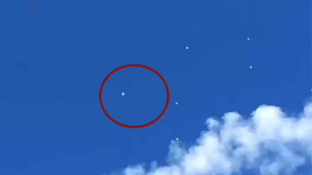 UFO Orbs in formation over the water in Nebraska.