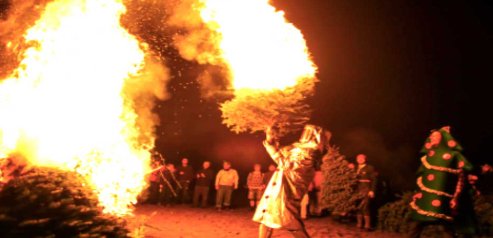 How to watch new year's eve 2018 tv coverage online Where do people burn Christmas tree bonfires on the street on the New Year's Eve?