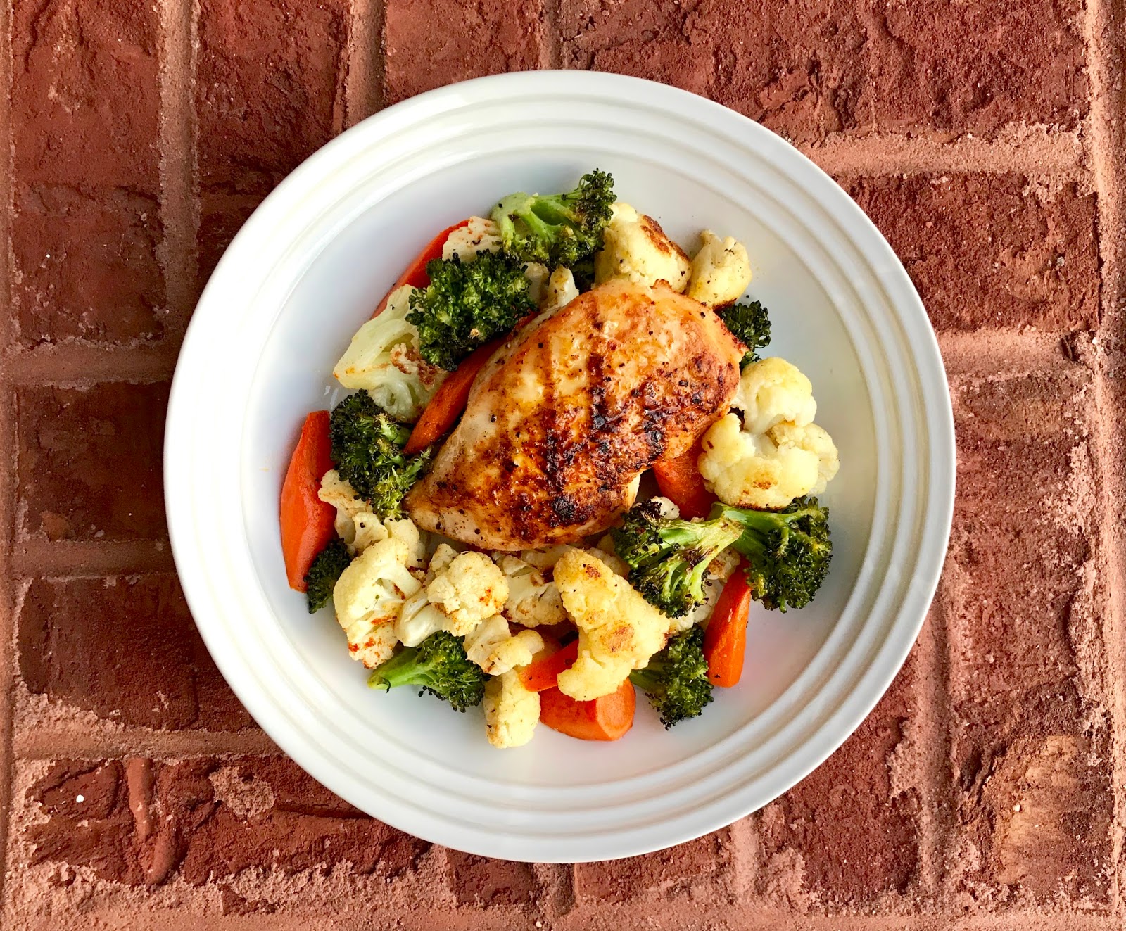 Gourmet Girl Cooks Grilled Chicken atop a Roasted Vegetable Medley