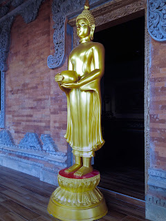 Standing Buddha Statue Carrying Jug At Brahmavihara Arama Monastery North Bali