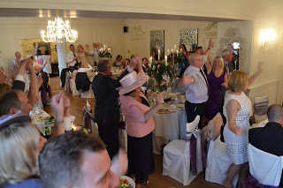 Dancing during the wedding breakfast at Eaves Hall with singer John Norcott