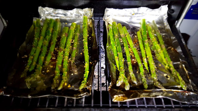 Asparagus cooking in trays with the left over fat from the Chicken. Just cook till crisp.