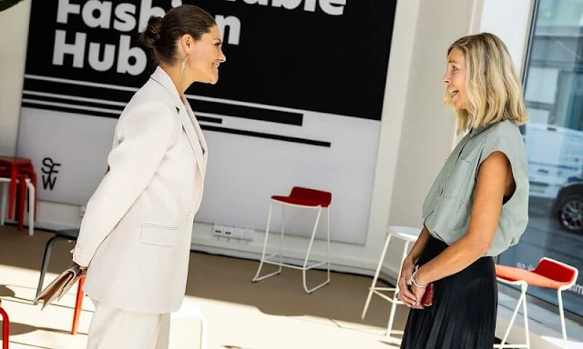 Crown Princess Victoria wore a cream suit by Andiata. Kreuger Jewellery summer feather earrings. By Malene Birger Koonia clutch