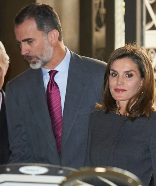 Queen Letizia carries Madmacarena python snake clutch bag. Uterque shoes, diamond jewellery earring