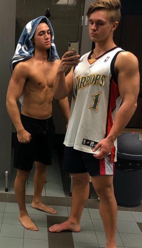 two-young-fit-high-school-teen-jocks-jerseys-shirtless-locker-bathroom-selfie