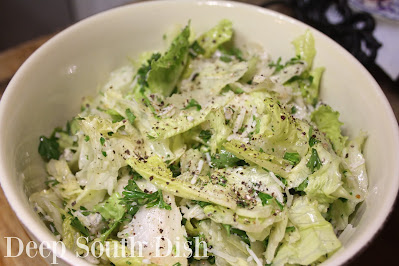 A mixed garden salad made with romaine and iceberg lettuces, fresh parsley, Romano and bleu cheeses, lot of freshly cracked black pepper and a tangy, lemon-garlic vinaigrette.