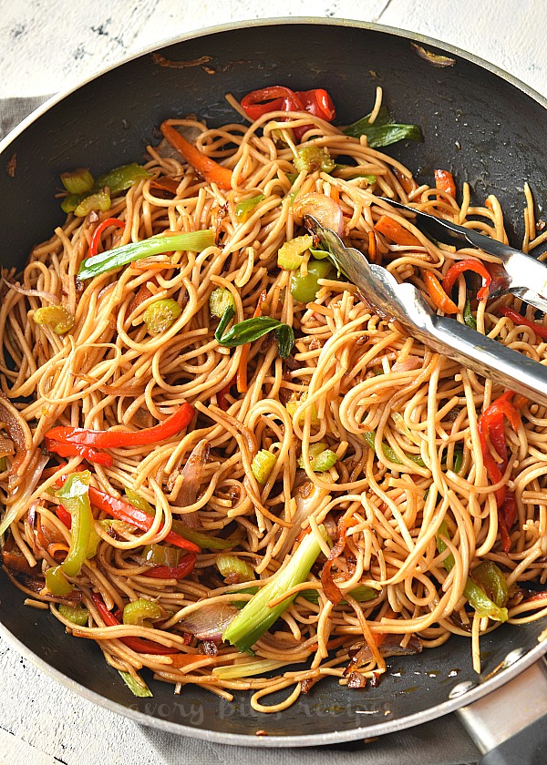 a close look of vegetable lo mein with spring onion,carrots,celery and bell peppers