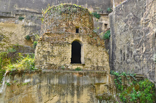 The tomb of Virgil, at the entrance to the  grotta vecchia in Piedigrotta, near Naples