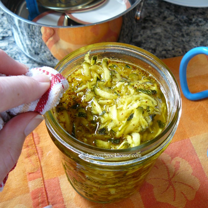 wiping rim of jar before sealing zucchini relish
