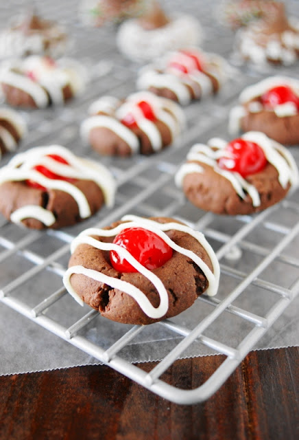 Cherry Chocolate Thumbprint Cookies ~ cute little cookies inspired by the flavors of classic chocolate covered cherries. Perfect for Christmas, Valentine's Day, or ANY day!  www.thekitchenismyplayground.com