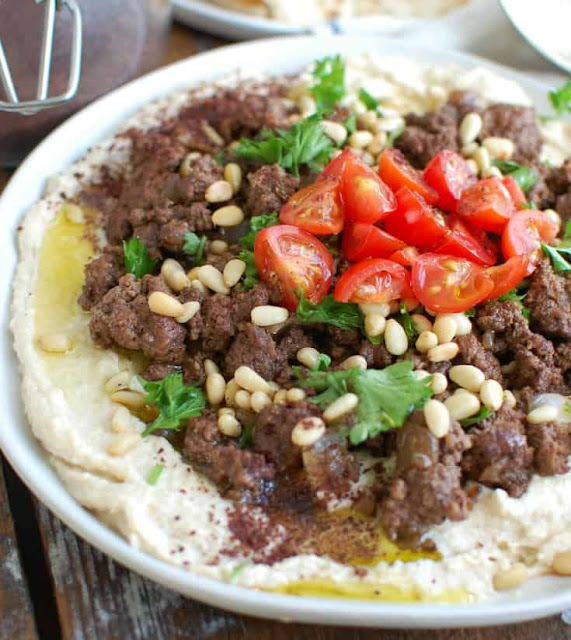 HUMMUS WITH SPICED BEEF AND TOASTED PINE NUTS