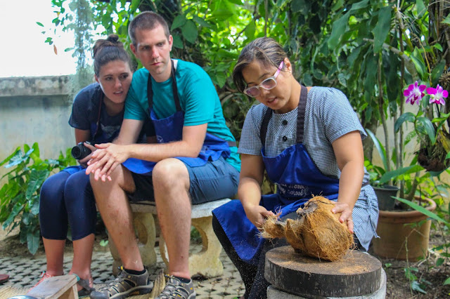 Thai Secret Cooking Class Cracking coconuts to make home made coconut milk. June 22-2017