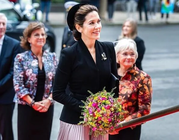 Queen Margrethe, Princess Benedikte. Crown Princess Mary wore a rose gold metallic pleated midi skirt from Asos Design, and a blazer by Max Mara