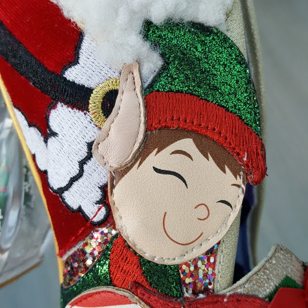 close up of boy elf applique on side of shoe