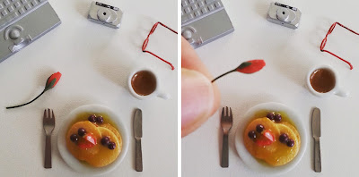 Two flat-lay instagram photos of a dolls' house miniature pancake breakfast surrounded by a laptop, digital camera, reading glasses and a mug of coffee. In the left photo there is a rose bud on the table, in the right one it is being held up to show how small it is.