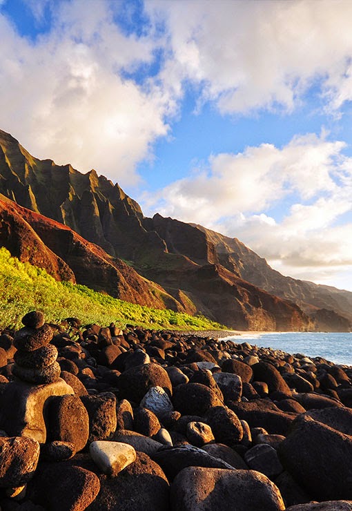 The Nā Pali Coast State Park encompasses 6,175 acres  of land and is located in the center of the rugged 16 miles  along the northwest side o