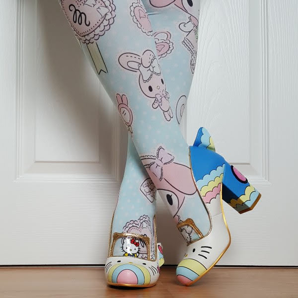 crossed legs wearing Sanrio printed tights and shoes