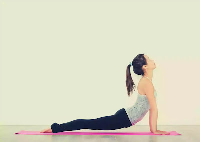 girl practicing bhujangasana