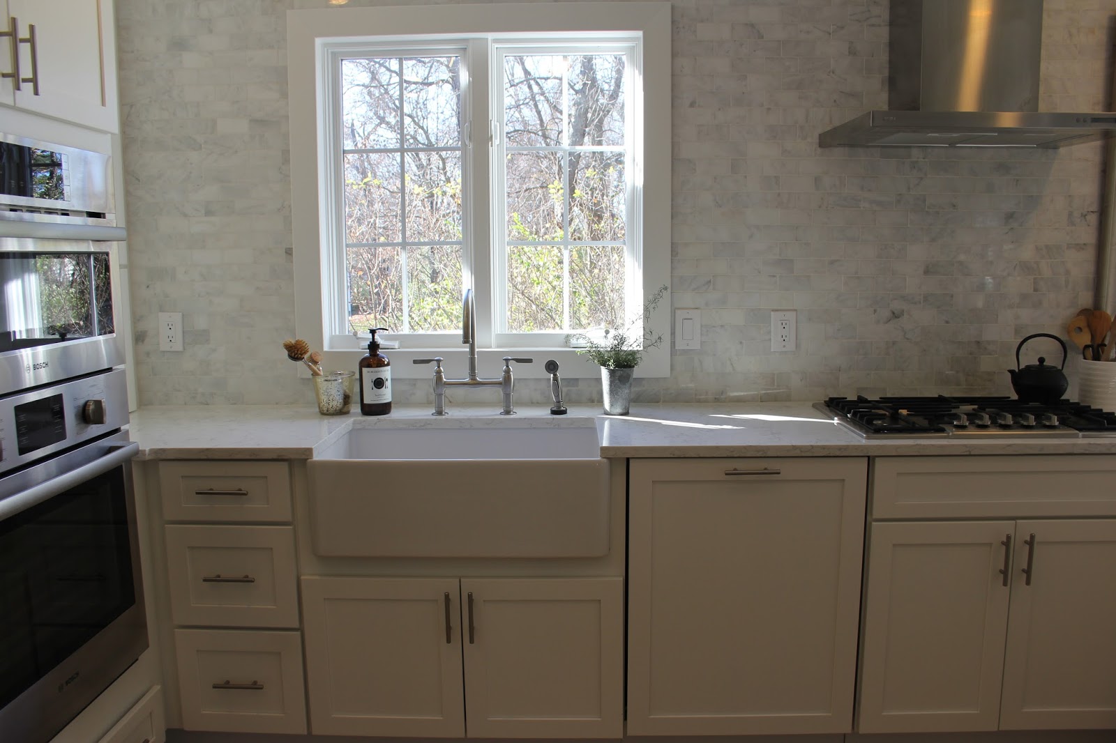 hello-lovely-studio-fixer-upper-white-kitchen-spare-farmhouse-table