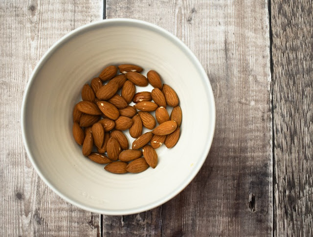 almonds in a small white bowl