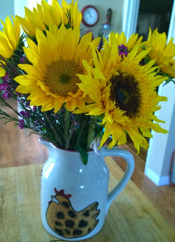 Sunflowers in a rooster jug #sunflowers