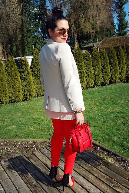 Helmut Lang gala knit blazer, gold aviator sunglasses, red Rockstar jeans and a red Celine Nano..