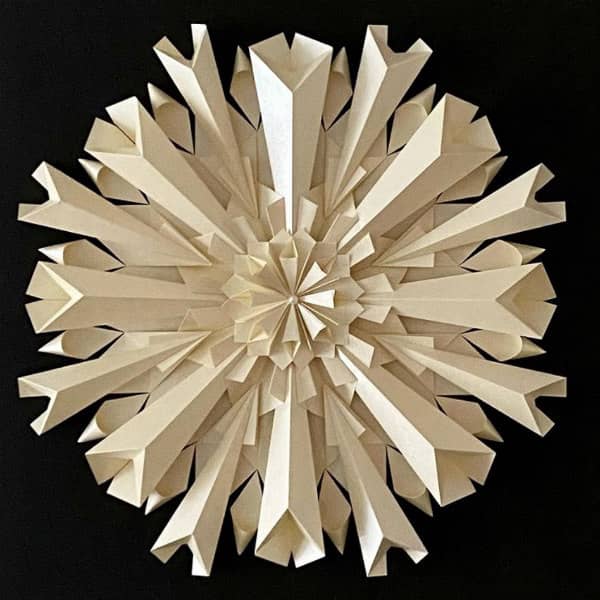all-white 3D paper sculpture reminiscent of the Covid-19 virus shape