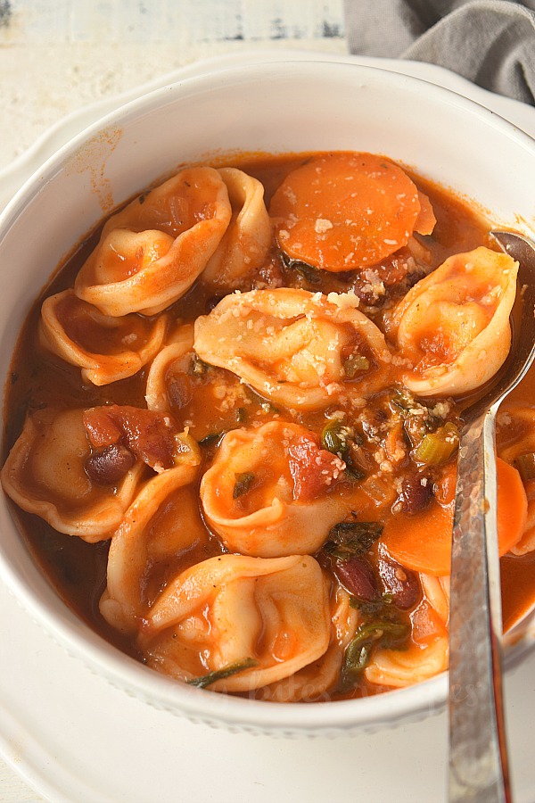 a close look of bowl with cheese tortellini minestrone soup