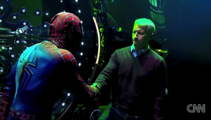 Anderson Cooper shaking hands with Spider-Man