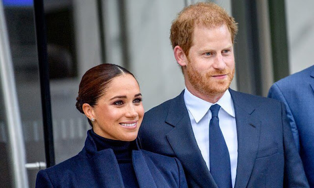 Meghan Markle wore a high-neck sweater with trousers underneath a long coat