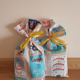 https://www.etsy.com/listing/725054906/christmas-gift-bags-set-of-two-holidays?ref=listings_manager_grid