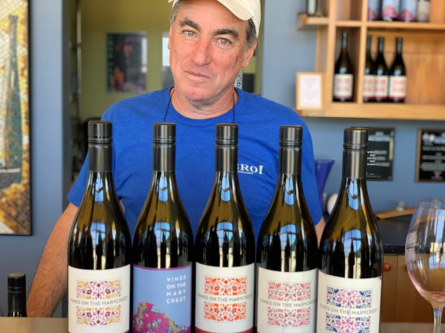 Victor Abascal of Vines on the Marycrest with five wine bottles