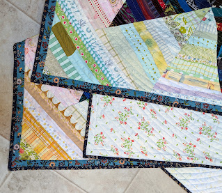 Folded quilt highlights front, back, binding, and quilting.