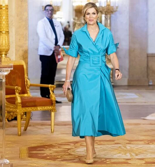 Queen Maxima wore a new blue Taffeta shirt dress from Natan, blue diamond earrings