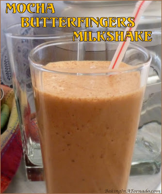 Mocha Butterfingers Milkshake, vanilla and mocha flavored ice cream is infused with butterfingers candy bits for a unique sweet treat. | Recipe developed by www.BakingInATornado.com | #recipe #sweet