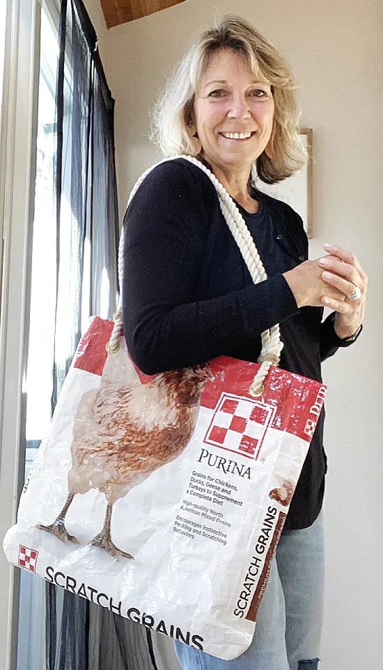 susan with chicken feed bag