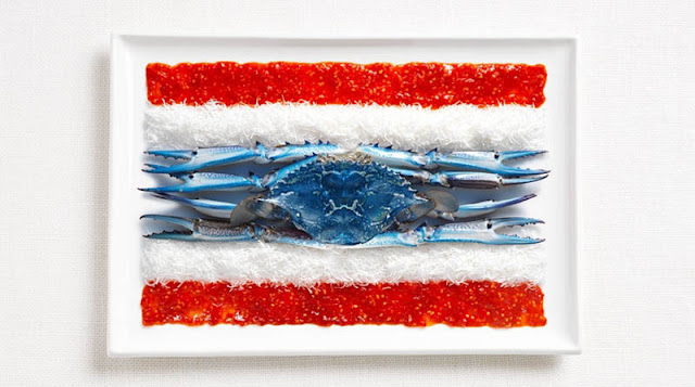 Flag of thailand made from food, sweet chilly sauce, shredded coconut and blue swimmer crabs