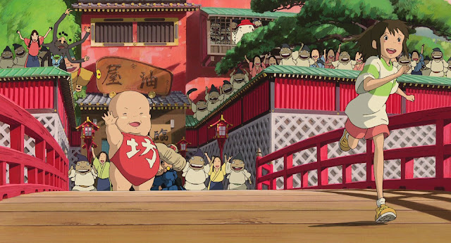 A movie still from Spirited Away, a young girl (Chihiro) running in the forefront over a bridge. In the background are all the spirits and denizens of the underworld including a giant baby waving goodbye