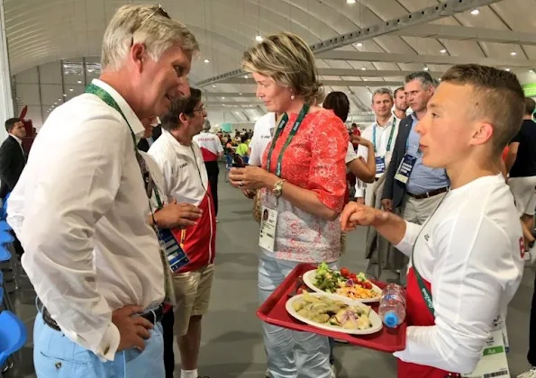 Queen Mathilde visited the Olympic Village, Queen wore Jeans trousers, printed blouse, wore Natan flat shoes, wore Cartier sungless Sunglasses, gold diamond earrings