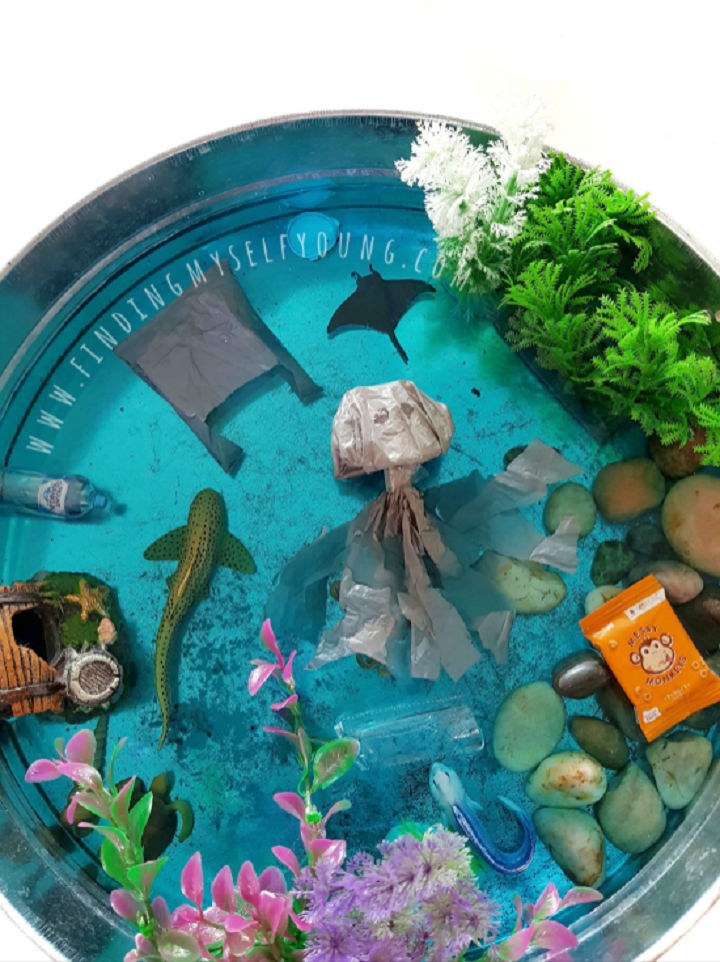 ocean themed play tray with plastic bag and jellyfish