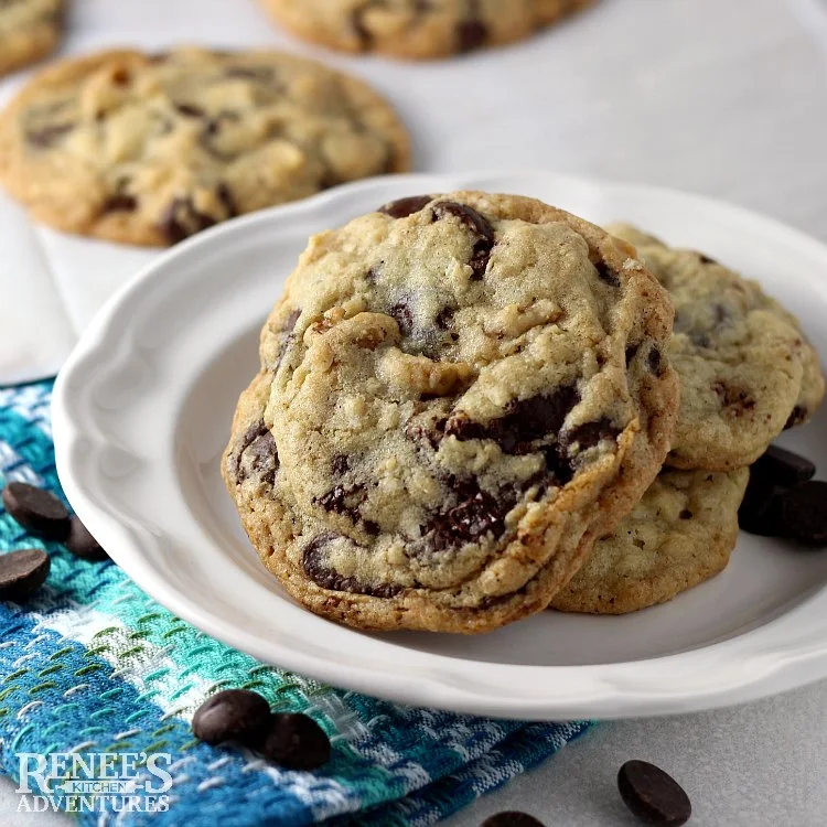 DoubleTree Chocolate Chip Cookies on a white plate with more in the background