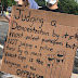 Sign from a protest in Charlotte, NC explaining double standards at play