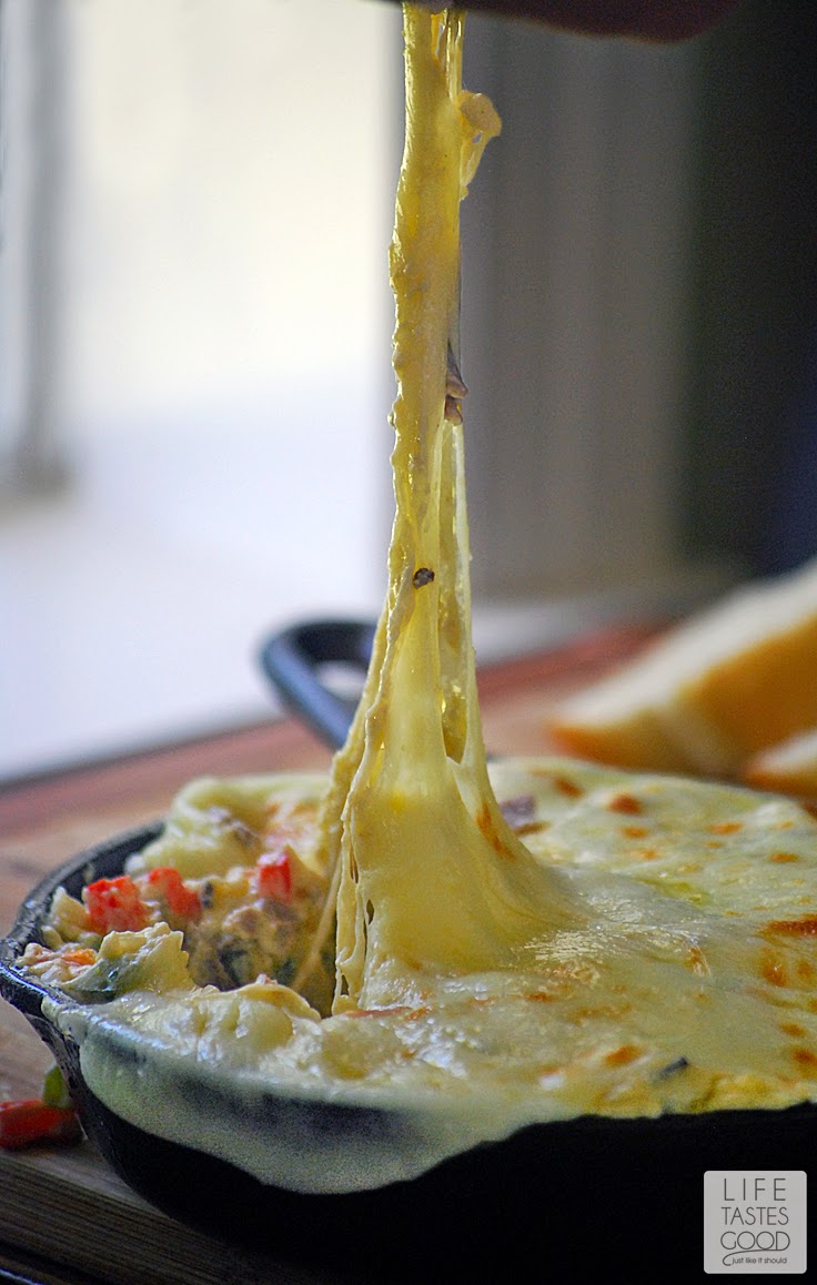 Philly Cheesesteak Dip | by Life Tastes Good is a new twist on that classic sandwich from the City of Brotherly Love! It is a cheesy dip loaded with flavorful beef, onions, peppers, and garlic too! I really can't get enough of this dip! I'm a bit obsessed! #SundaySupper